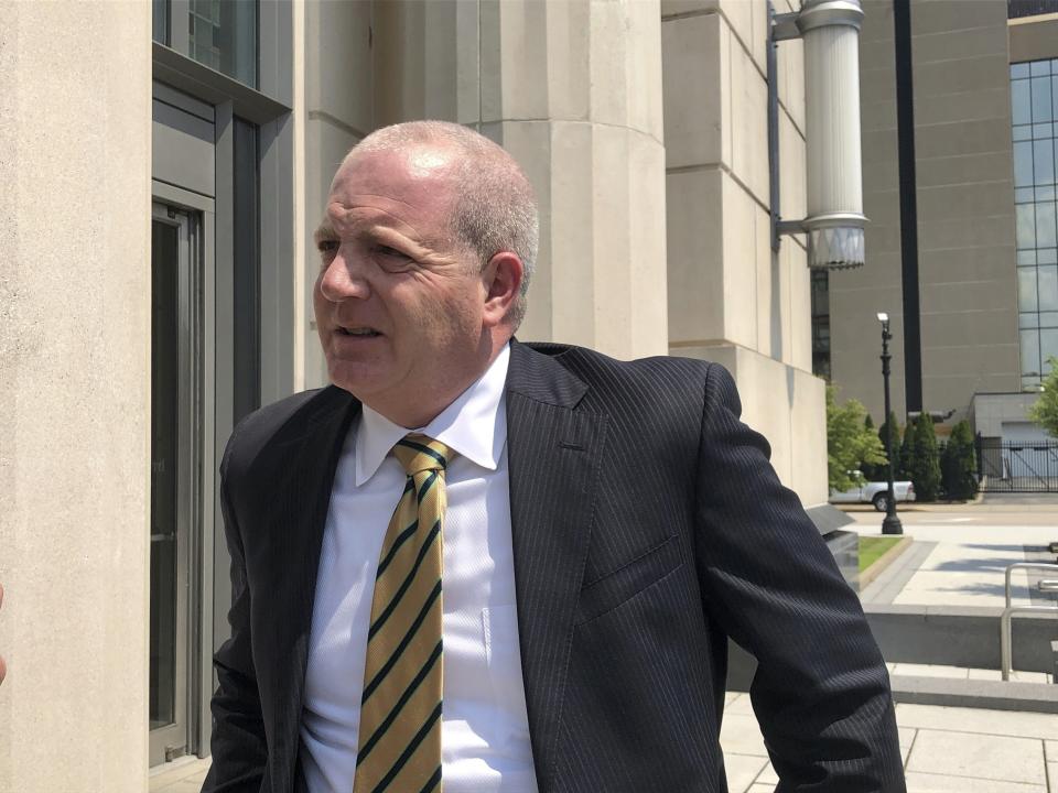 FILE - Paul T. Farrell Jr., an attorney representing plaintiffs in a lawsuit against three major U.S. drug distributors, speaks to reporters Wednesday, July 28, 2021, outside the federal courthouse in Charleston, W.Va. Last July, a federal judge in West Virginia heard closing arguments in the first lawsuit to go to trial over the U.S. opioid addiction epidemic. With an avalanche of documents from the three-month trial, Judge David Faber didn’t indicate when he would make a ruling on the multibillion-dollar lawsuit filed by Cabell County and the city of Huntington against three major drug distributors, and his decision wasn't expected right away. (AP Photo/John Raby)