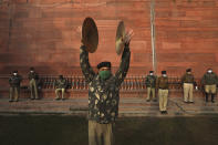 An Indian Border Security Force soldier rehearses during a brass band practice for the upcoming Republic Day parade in New Delhi, India, Thursday, Jan. 21, 2021. Republic Day marks the anniversary of the adoption of the country's constitution on Jan. 26, 1950. Thousands congregate on Rajpath, a ceremonial boulevard in New Delhi, to watch a flamboyant display of the country’s military power and cultural diversity. (AP Photo/Manish Swarup)