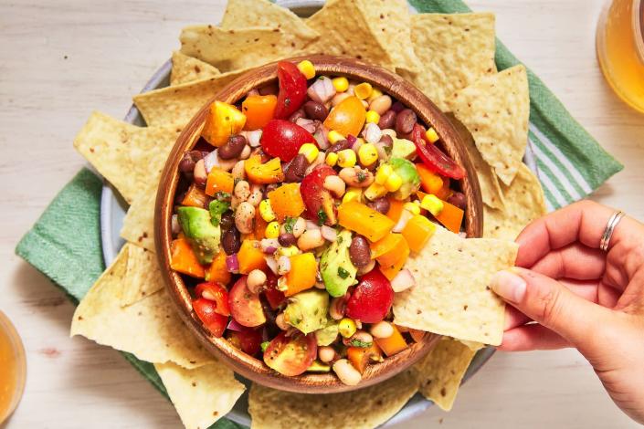 <p>Some call it Cowboy Caviar; others call it Texas Caviar. Different names, same idea, and lots of variations—we love ours for how delicious <em>and</em> health-supportive it is. Black-eyed peas contain vitamin K, black beans aid in lowering blood pressure, and avocados contain omega-3 fatty acids. 😍</p><p>Get the <strong><a href="https://www.delish.com/cooking/recipe-ideas/a53100/cowboy-caviar-recipe/" rel="nofollow noopener" target="_blank" data-ylk="slk:Cowboy Caviar recipe" class="link ">Cowboy Caviar recipe</a></strong>.</p>