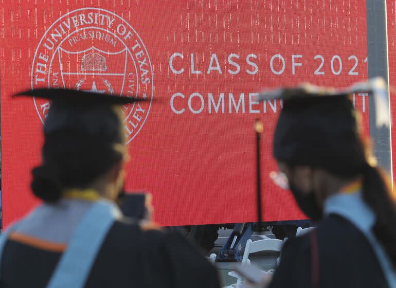 FILE - Graduates of the University of Texas Rio Grande Valley attend their commencement ceremony at the schools parking lot on Friday, May 7, 2021, in Edinburg, Texas. New rules proposed by the Biden administration on Wednesday, July 6, would make it easier for borrowers to get their federal student debt forgiven through several existing programs. (Delcia Lopez/The Monitor via AP, File)