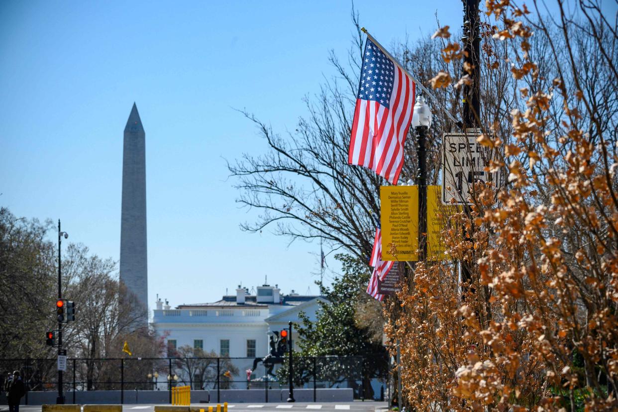 <p>The Stars and Stripes hangs over Black Lives Matter Plaza in Washington DC – with an extra star symbolising the ambition of making the District of Columbia the 51st state of the USA</p> (AFP via Getty Images)
