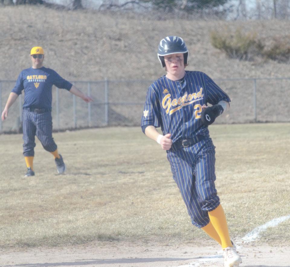 Isaac Hopp scores a run during a baseball matchup between Gaylord and Rudyard on Tuesday, April 11.