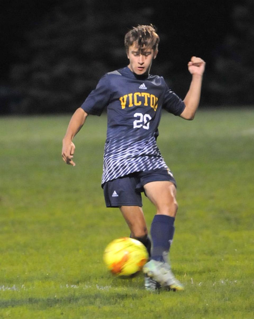 Micah Bajus of Victor pushes the ball ahead in the first half of Wednesday's match against Churchville-Chili.