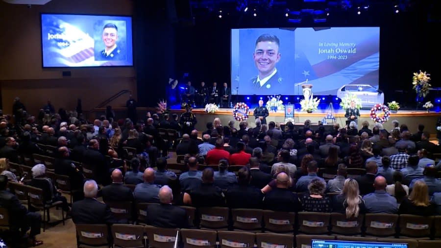 Hundreds pack a Lenexa church for the funeral service for fallen Fairway Officer Jonah Oswald on Aug. 14, 2023.