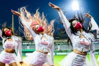 In baseball-mad South Korea teams of professional cheerleaders pump up players and fans with elaborate K-pop routines (AFP/Anthony WALLACE)