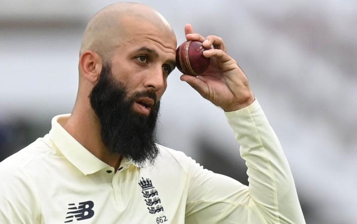 Moeen Ali bowling for England - AFP