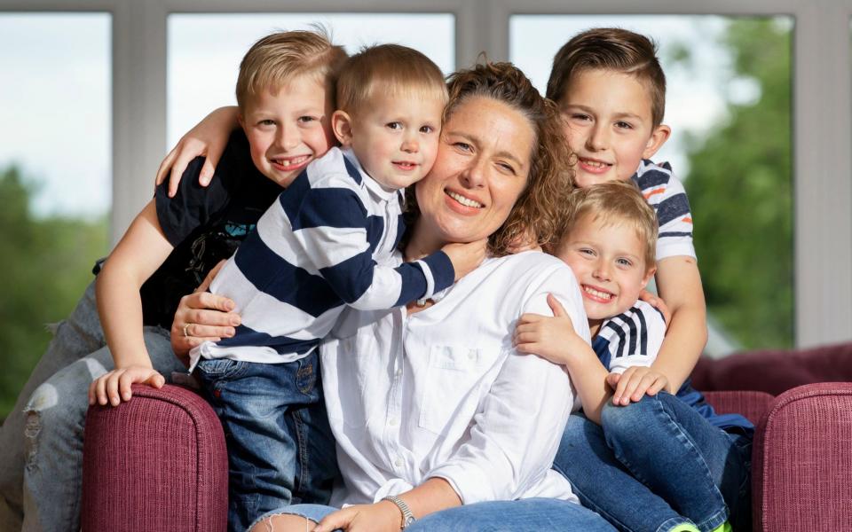 Undated photo issued by Cancer Research UK showing Lynsey Ritchie, 44, at home in Denny, Stirlingshire with her sons, Odhran, 3, Darragh 5, Brodie, 7, and Cailean, 9. Lynsey Ritchie is appearing in a campaign, launched by Cancer Research UK, showing cancer survivors calling for people to seek medical help if they have any symptoms and use screening services. Issue date: Tuesday June 15, 2021. PA Photo.  - PA