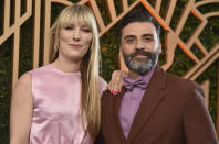 Elvira Lind, and Oscar Isaac, right, arrive at the 28th annual Screen Actors Guild Awards at the Barker Hangar on Sunday, Feb. 27, 2022, in Santa Monica, Calif. (Photo by Jordan Strauss/Invision/AP)
