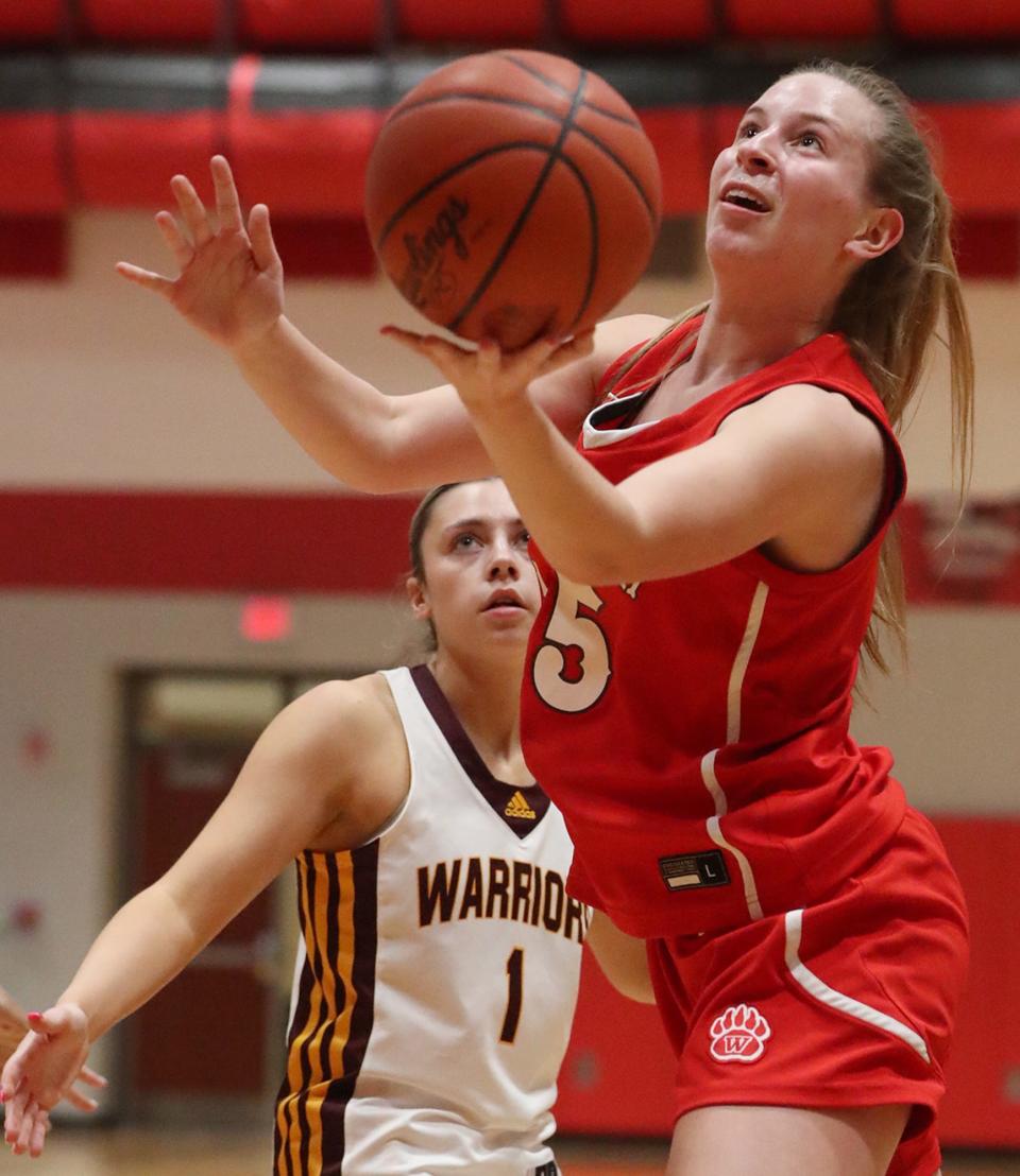 Walsh Jesuit's Cesily Sutton looks on as Wadsworth's Brooke Baughman goes to the basket during the Suburban vs. City Women's Tri-County Basket Ball Coaches Association 20204 Senior All-Star Game on Monday in Norton.