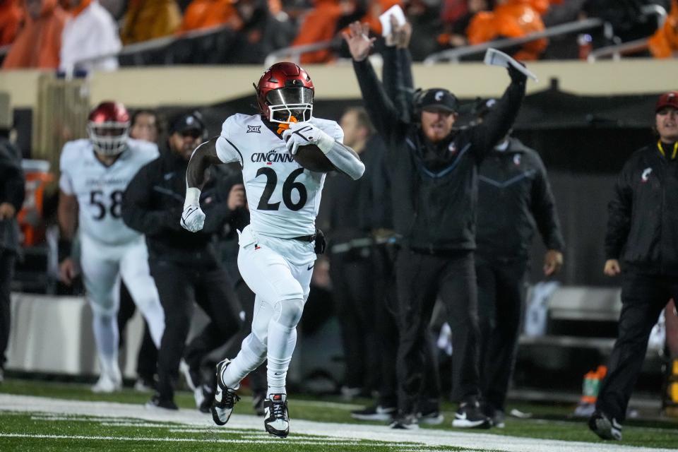 Cincinnati Bearcats running back Myles Montgomery (26) runs deep for a touchdown in the first quarter of the NCAA Big12 football game between the Oklahoma State Cowboys and the Cincinnati Bearcats at Boone Pickens Stadium in Stillwater, Okla., on Saturday, Oct. 28, 2023.