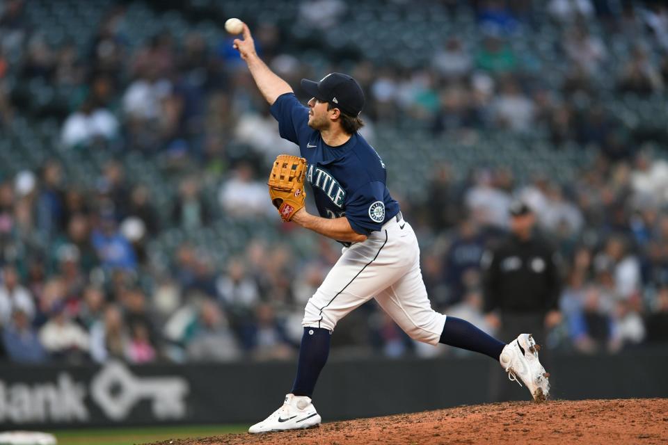 Mariners catcher Luis Torrens pitches against the Tigers during Tigers' 7-6 loss in 10 innings in Game 1 of the doubleheader on Tuesday, Oct. 4, 2022, in Seattle.