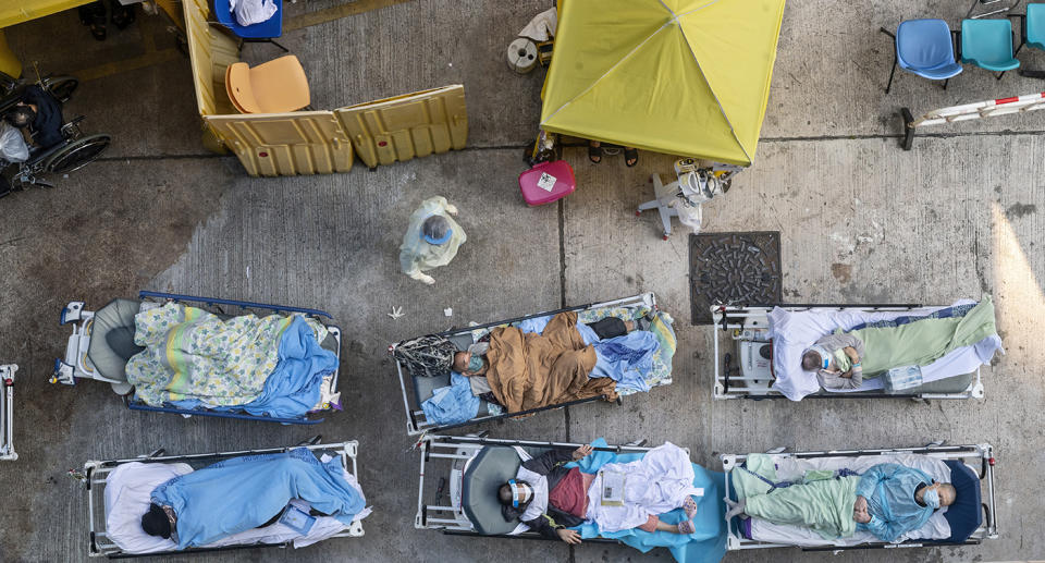 Arial view showing six beds outside with tents set up for emergency treatment with Hong Kong hospitals at capacity with Covid patients.