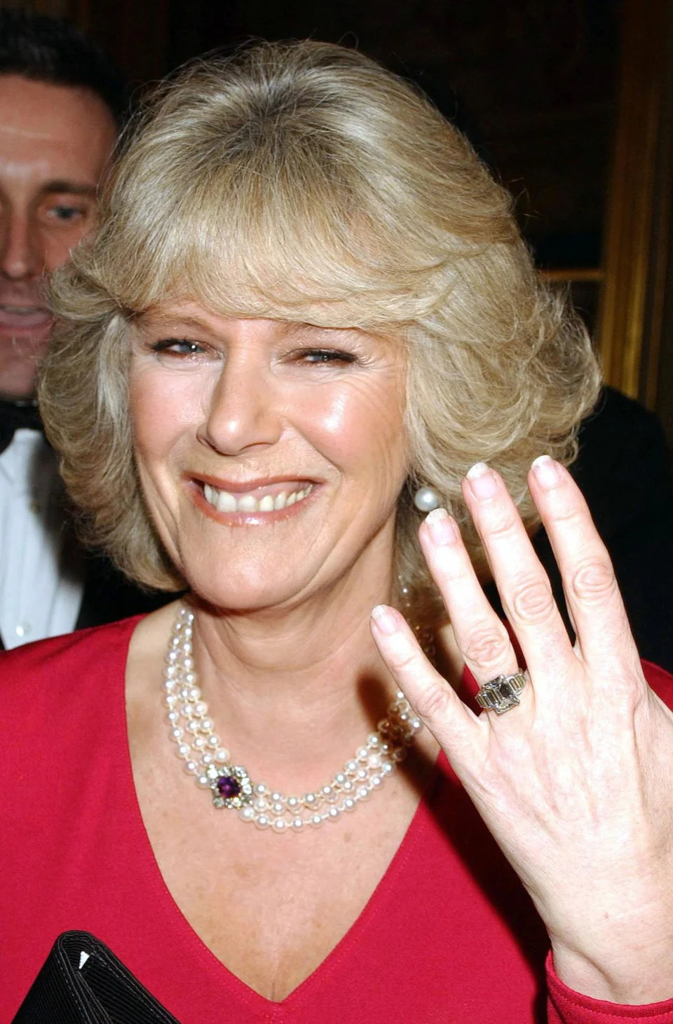 Camilla Parker Bowles shows her engagement ring when she arrives for a party at Windsor Castle after announcing their engagement earlier 10 February, 2005.  Britain's Prince Charles and his longtime companion Camilla Parker Bowles are to marry, his office announced Thursday, putting the official seal on a relationship that first blossomed 35 years ago. (Photo by Anwar Hussein/WireImage)