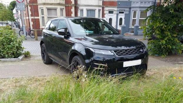 Car parked on pavement 