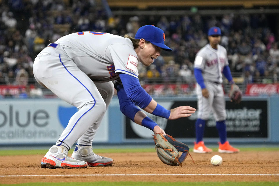 New York Mets third baseman Brett Baty fields a ball hit by Los Angeles Dodgers' Miguel Vargas during the second inning of a baseball game Monday, April 17, 2023, in Los Angeles. Baty threw out Max Muncy who was advancing to second on the play. (AP Photo/Mark J. Terrill)