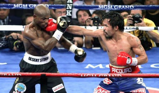 Manny Pacquiao (R) lands a punch on Timothy Bradley's face during their WBO welterweight title fight on June 9. Promoter Bob Arum said he would ask the Nevada attorney general's office "for a full and complete inquiry" into the controversial Bradley-Pacquiao title fight