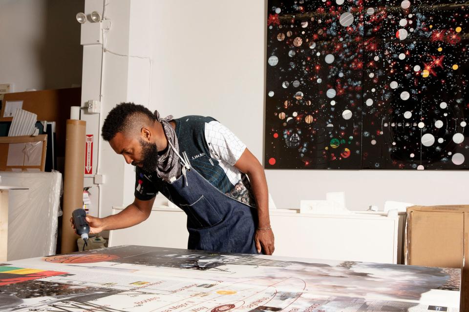 Artist Tavares Strachan, here working at the Isolated Labs studio in New York City in 2021, was born in 1979 in Nassau, Bahamas.