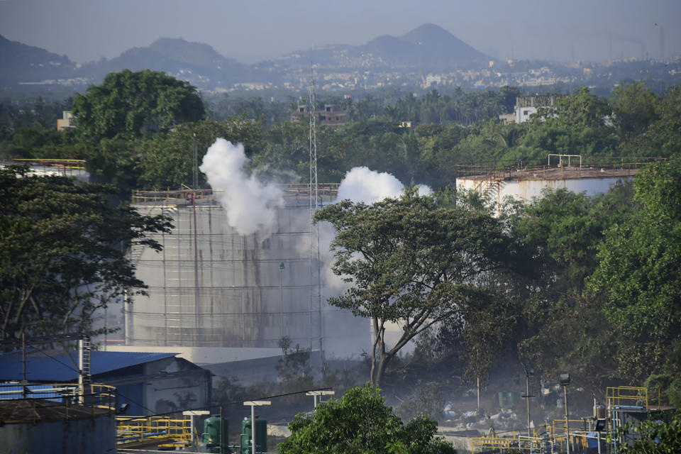 Smoke rises from LG Polymers plant, the site of a chemical gas leakage, in Vishakhapatnam, India, Thursday, May 7, 2020. Synthetic chemical styrene leaked from the industrial plant in southern India early Thursday, leaving people struggling to breathe and collapsing in the streets as they tried to flee. Administrator Vinay Chand said several people fainted on the road and were rushed to a hospital. (AP Photo)