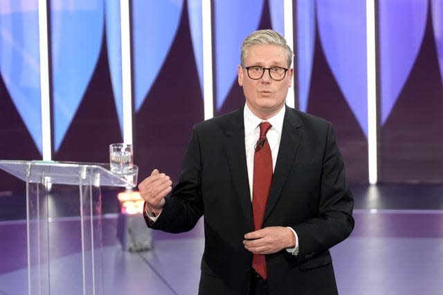 Labour leader Sir Keir Starmer stands in front of a lectern in a TV studio