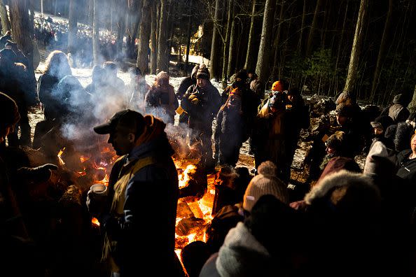 PUNXSUTAWNEY, PA - FEBRUARY 02: A group of people stand next to a bonfire while waiting to see Phil on February 2, 2023 in Punxsutawney, Pennsylvania. Groundhog Day is a popular tradition in the United States and Canada. A crowd of upwards of 10,000 people spent a night of revelry awaiting the sunrise and the groundhog's exit from his winter den. If Punxsutawney Phil sees his shadow, he regards it as an omen of six more weeks of bad weather and returns to his den. Early spring arrives if he does not see his shadow, causing Phil to remain above ground.  (Photo by Michael Swensen/Getty Images)