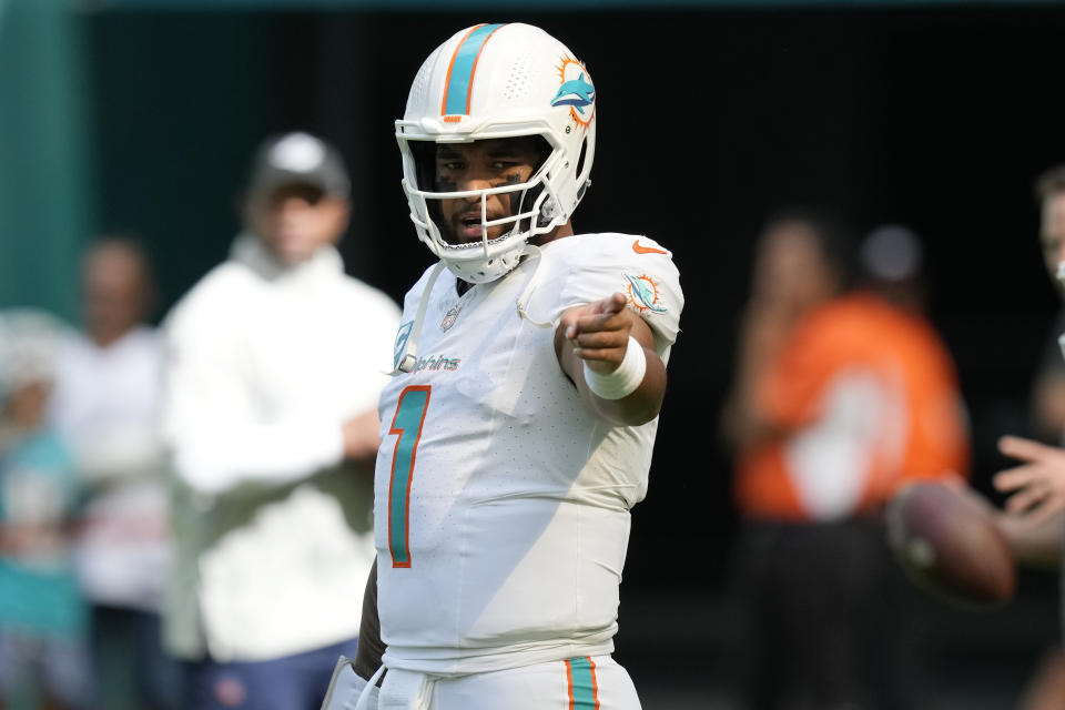 Miami Dolphins quarterback Tua Tagovailoa (1) gestures before an NFL football game against the New York Jets, Sunday, Dec. 17, 2023, in Miami Gardens, Fla. (AP Photo/Rebecca Blackwell)