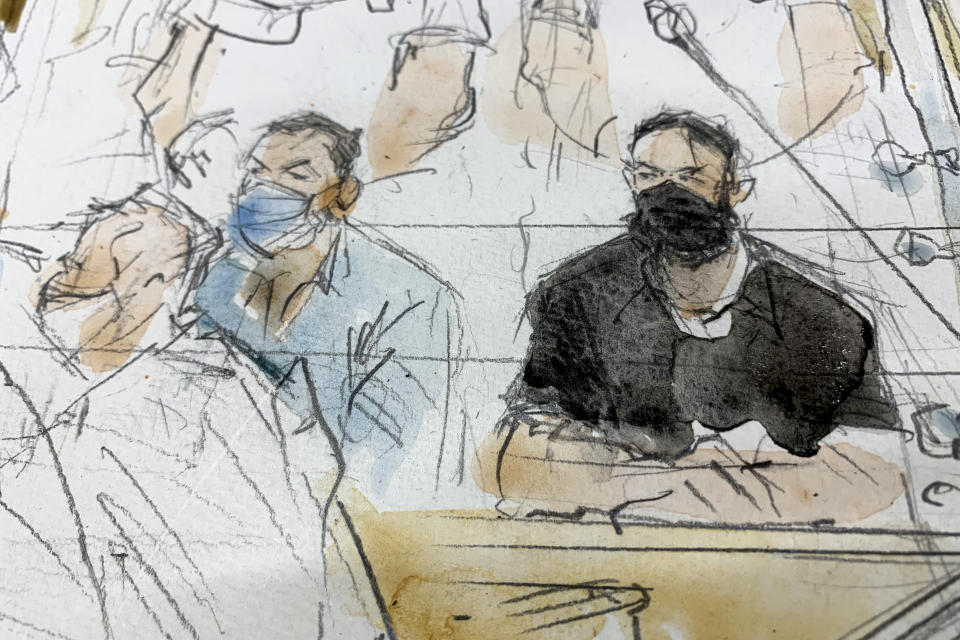 FILE - Sept.8, 2021 file sketch shows key defendant Salah Abdeslam, right, and Mohamed Abrini in the special courtroom built for the 2015 attacks trial. Salah Abdeslam is one of 10 attackers who set out Nov. 13, 2015 wearing explosives vests for a series of coordinated attacks. For charges including terrorist murder and kidnapping, he faces up to life in prison. For charges including complicity to terrorist murder, Mohamed Abrini risks up to a life sentence. A total of 20 people are facing a verdict Wednesday June 29, 2022 over the 2015 Paris attacks by Islamic State extremists that killed 130 people. (Noelle Herrenschmidt via AP, File)