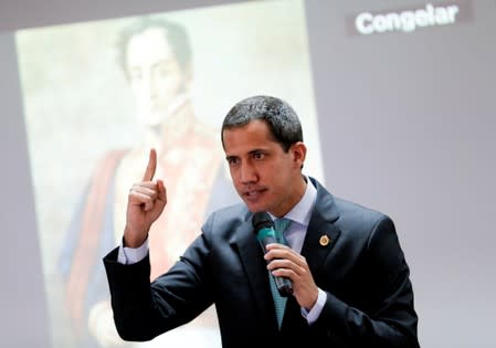 FILE PHOTO: Venezuelan opposition leader Juan Guaido, who many nations have recognized as the country's rightful interim ruler, attends a session of Venezuela's National Assembly in Caracas
