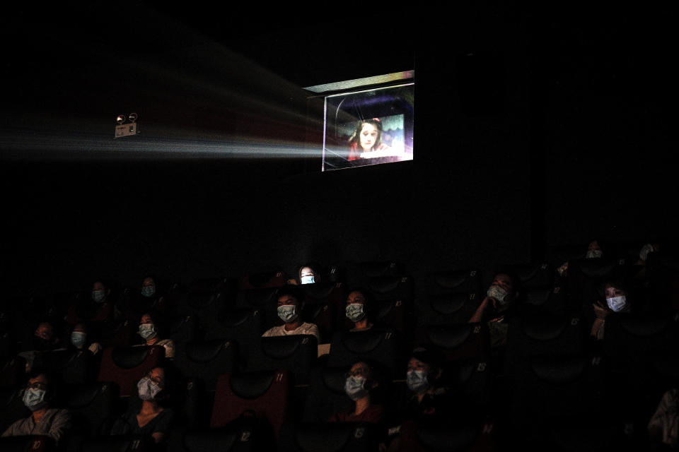 WUHAN, CHINA - JULY 20: (CHINA OUT)Residents watch a movie in a cinema in Wuhan on July 20, 2020 in Wuhan ,Hubei Province,China.Taking various measures against COVID-19, cinemas in the city reopened in an orderly manner on Monday. The China Film Administration, in a circular last week, allowed cinemas in low-risk areas to resume operation with effective epidemic prevention measures in place. (Photo by Getty Images)