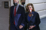 In this Oct. 1, 2021 photo, President Joe Biden and Speaker of the House Nancy Pelosi, D-Calif., walk in a basement hallway of the Capitol after meeting with House Democrats, on Capitol Hill in Washington. Divided Democrats struggling to enact President Joe Biden’s domestic agenda are confronting one of Congress’ cruelest conundrums — your goals may be popular, but that doesn't ensure they'll become law or that voters will reward you. (AP Photo/J. Scott Applewhite)