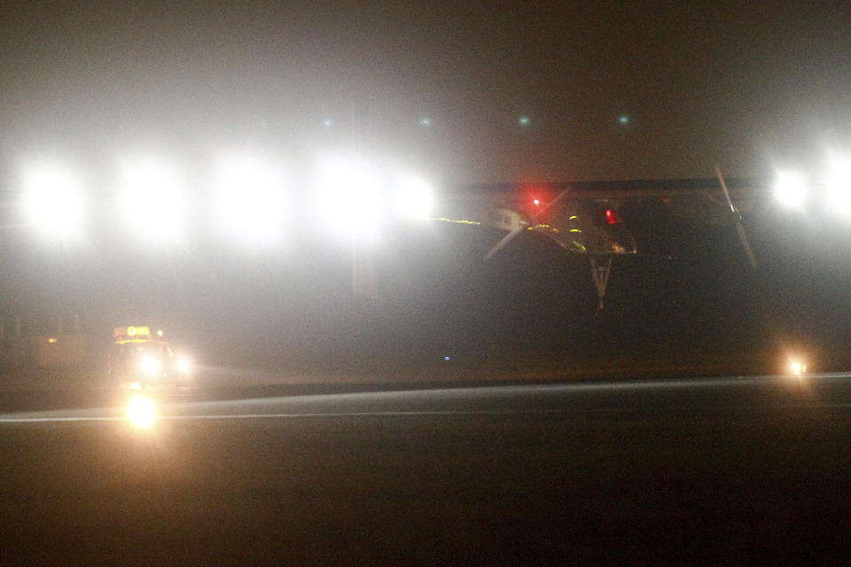 An experimental solar-powered plane, Solar Impulse, approaches to make a night landing at Rabat airport, Morocco, Tuesday, June 5, 2012. The solar-powered plane landed in Morocco's capital late Tuesday after a 20-hour trip from Madrid in the first transcontinental journey by a craft of its type. (AP Photo/Abdeljalil Bounhar)