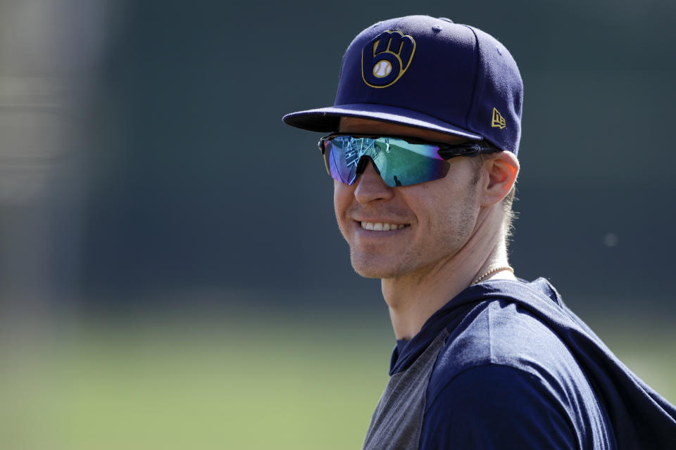 Milwaukee Brewers infielder Brock Holt looks on during spring training baseball Wednesday, Feb. 19, 2020, in Phoenix. Holt and the Brewers finalized a one-year contract Wednesday, a deal that includes a team option for 2021. (AP Photo/Gregory Bull)