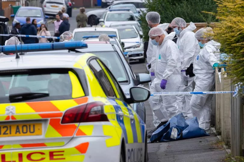 Forensic officers at the scene on Monday