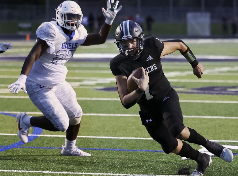 Corner Canyon’s QB Isaac Wilson runs past causes Bishop Gorman’s Key’trin Harris during a non-conference football game at Corner Canyon High school in Draper on Friday, Aug. 18, 2023. | Laura Seitz, Deseret News