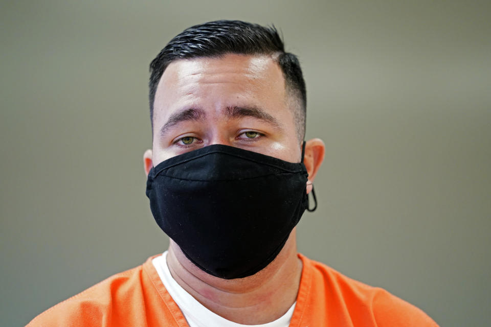 Immigration detainee Alexander Martinez speaks during an interview with The Associated Press inside the Winn Correctional Center in Winnfield, La., Friday, July 30, 2021. Since crossing the border illegally in April, the 28-year-old has bounced between six different facilities in three states. He said he contracted COVID-19, faced racist taunts and abuse from guards and was harassed by fellow detainees for being gay. (AP Photo/Gerald Herbert)