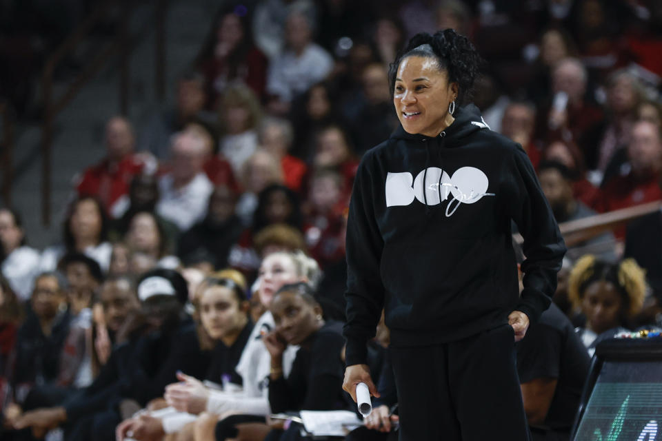 South Carolina head coach Dawn Staley laughs as her team plays against Vanderbilt during the first half of an NCAA college basketball game in Columbia, S.C., Sunday, Jan. 28, 2024. (AP Photo/Nell Redmond)