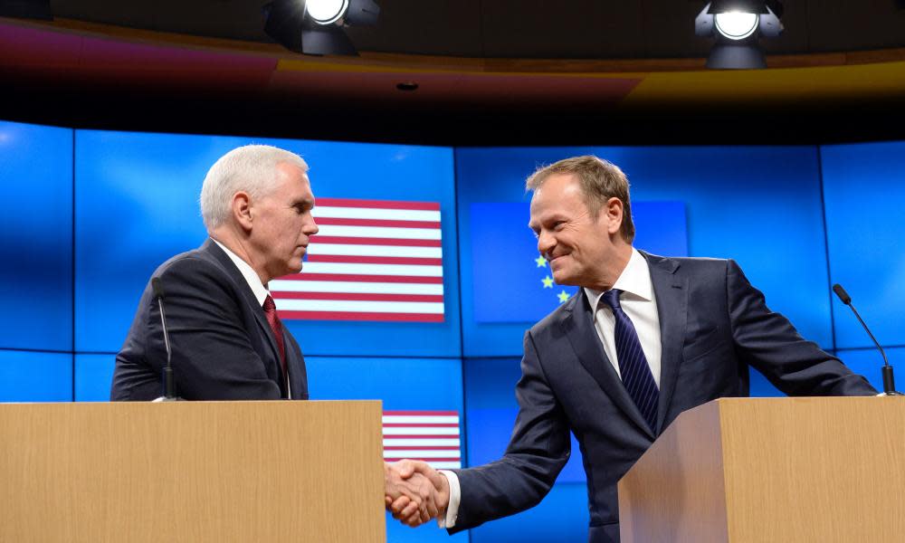 Mike Pence (left) shakes hands with Donald Tusk during a press conference at the European commission in Brussels.