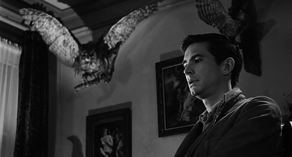 Anthony Perkins with a taxidermied owl.