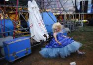 RNPS - PICTURES OF THE YEAR 2013 - A man relaxes in costume before a drag queen contest in Rome July 5, 2013. Following selections that began in January, drag queens from all over Italy have gathered in Rome to compete in the final of "Drag Factor: The Italian Race", a contest inspired by the X-Factor format. REUTERS/Max Rossi (ITALY - Tags: SOCIETY TPX)