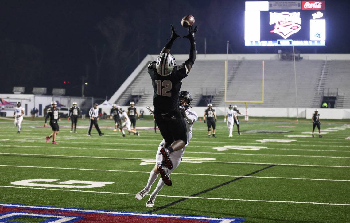 Jamarious Lockett (12) of Gray Collegiate pulls down a touchdown pass in front of CJ Moskos (3) of Oceanside Collegiate during the SCHSL Class 2A state championship between Gray Collegiate and Oceanside Collegiate at Oliver C. Dawson Stadium in Orangeburg on Thursday, November 30, 2023.