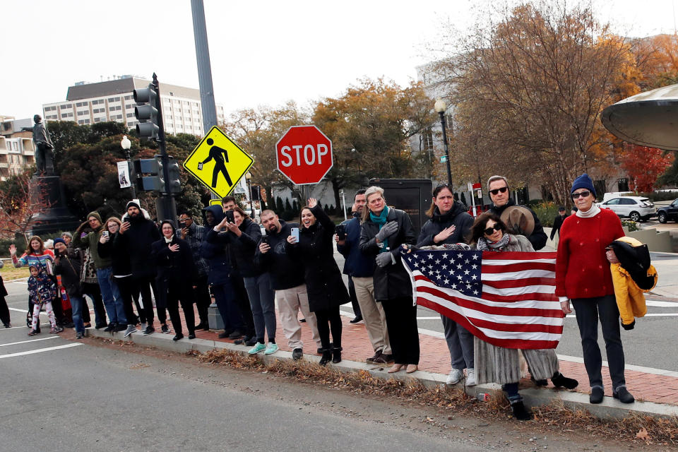 People line the streets to pay their respects as the hearse with the casket of former President George H.W. Bush passes by on the way to Andrews Air Force Base after a State Funeral at the National Cathedral, Wednesday, Dec. 5, 2018, in Washington. (Photo: Alex Brandon/Pool via Reuters)