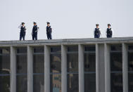 <p>Police officers stand guard atop of a building before arrival of U.S. President Barack Obama at Hiroshima Peace Memorial Park and Museum in Hiroshima, Japan May 27, 2016. (Photo: Toru Hanai/Reuters) </p>