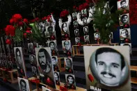 <p>Photographs of what are said to be political prisoners held by Iran stand posted with roses during a rally against Iranian President Ebrahim Raisi’s address at the UN General Assembly during the 77th Session of the United Nations General Assembly outside U.N. Headquarters in New York City, U.S., September 21, 2022. REUTERS/Shannon Stapleton</p> 