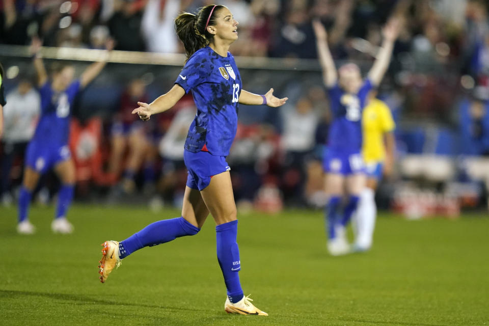 United States forward Alex Morgan (13) reacts to scoring a goal during the first half of a SheBelieves Cup soccer match against Brazil Wednesday, Feb. 22, 2023, in Frisco, Texas. (AP Photo/LM Otero)