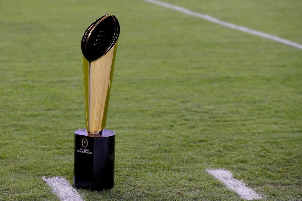 Who will vie for the College Football Playoff National Championship trophy? It’s down to four teams. (Getty)