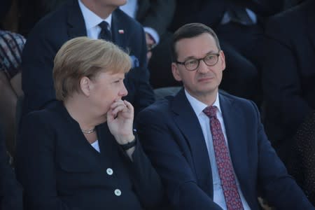Poland's Prime Minister Morawiecki and Germany's Chancellor Merkel attend a ceremony to mark the anniversary of the outbreak of World War Two in Warsaw