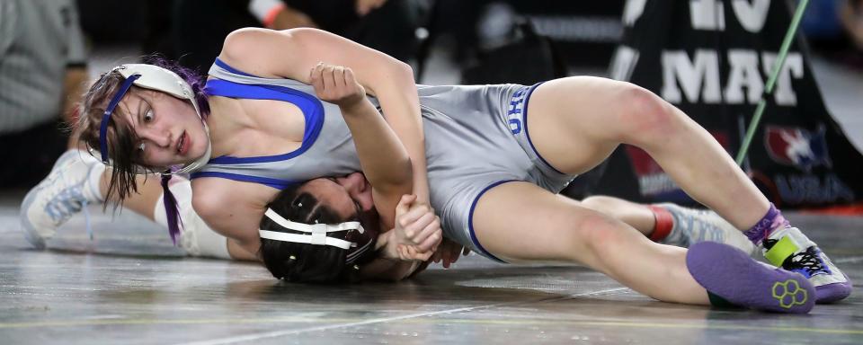 Olympic's Alexandria Templeton wrestles White River's Lilyana Lamothe for their 120-pound championship bout during Mat Classic at the Tacoma Dome on Saturday, Feb. 18, 2023.