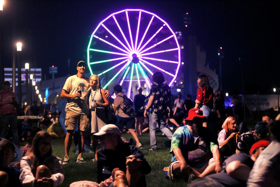 Fans lounge in the grass as they watch Stone Temple Pilots perform during Beale Street Music Fest at Liberty Park on Saturday, April 30, 2022. 