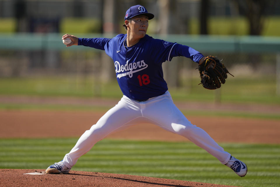 Los Angeles Dodgers pitcher Yoshinobu Yamamoto (18) throws a pitch during spring training baseball workouts at Camelback Ranch in Phoenix, on Saturday, Feb. 17, 2024. (AP Photo/Carolyn Kaster)