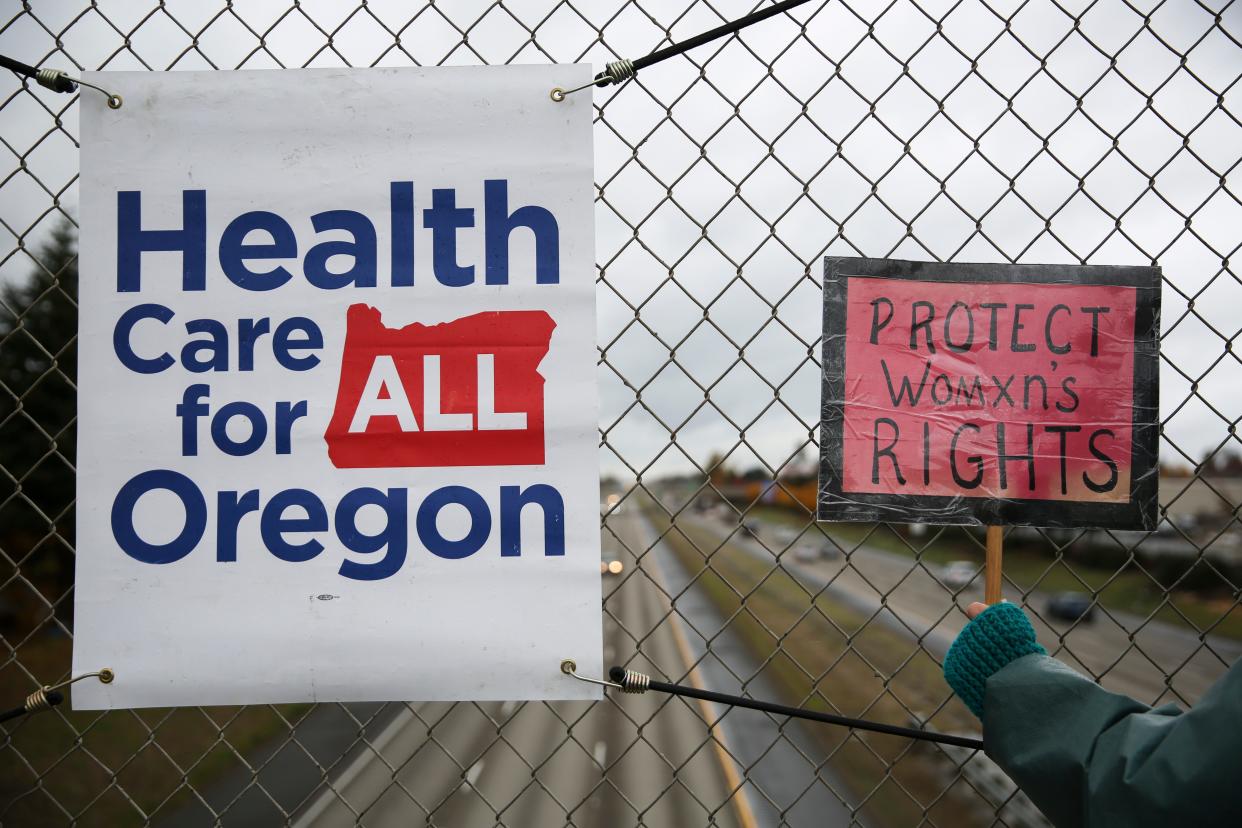 Health Care for All Oregon Marion County members and other activists rally together in response to the Supreme Court hearing on the Affordable Care Act, on Tuesday, Nov. 10, 2020 on the Center Street I-5 overpass in Salem, Oregon.