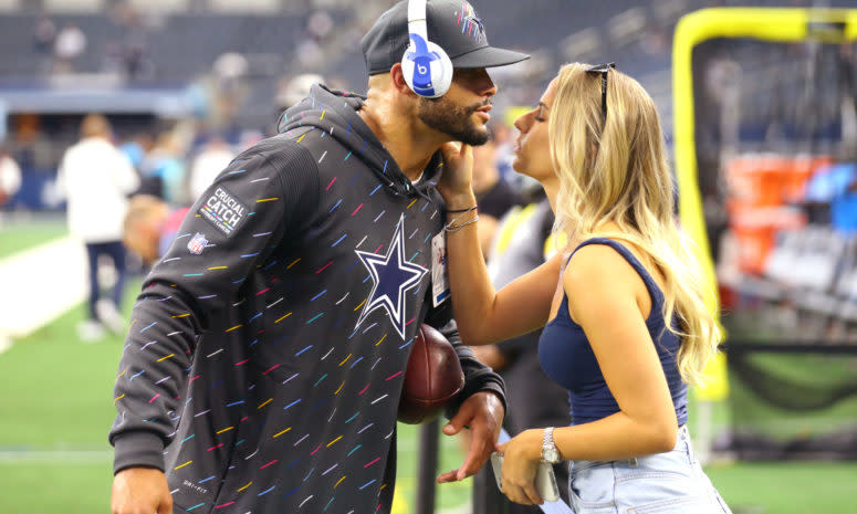 Dak Prescott kisses his girlfriend Natalie Buffett before a game.